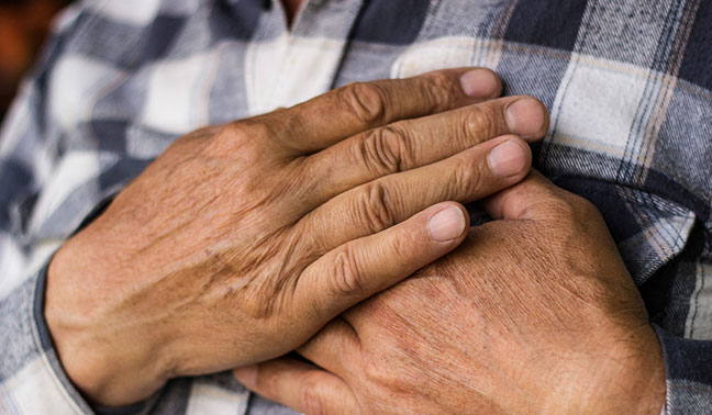 Man holding chest