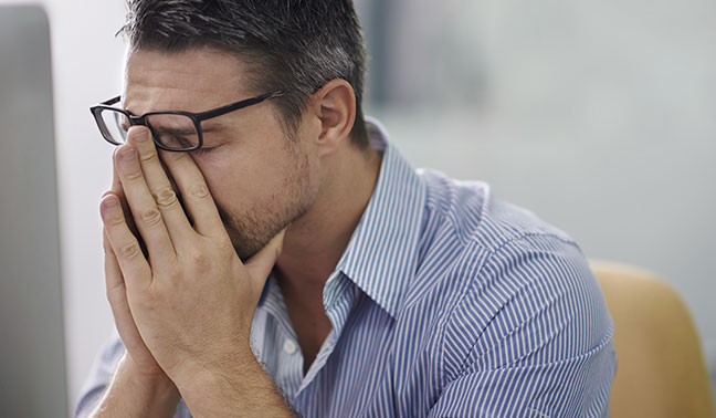 Man with vertigo sitting in chair