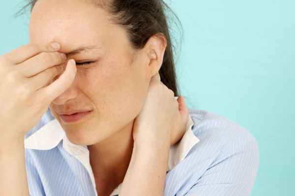 Woman experiencing a migraine