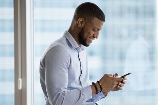 Man with head facing down while texting