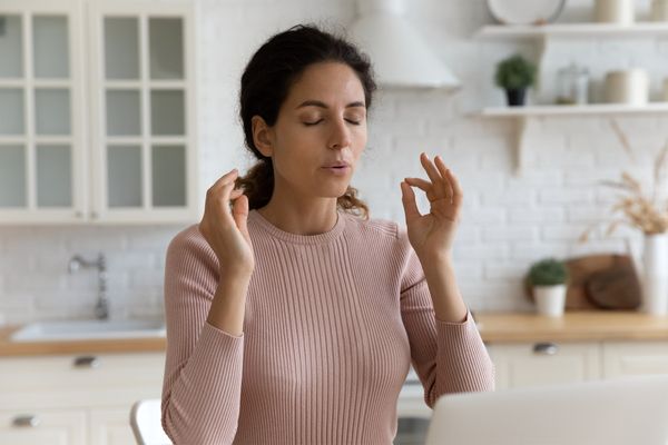 A woman breathing calmly at home