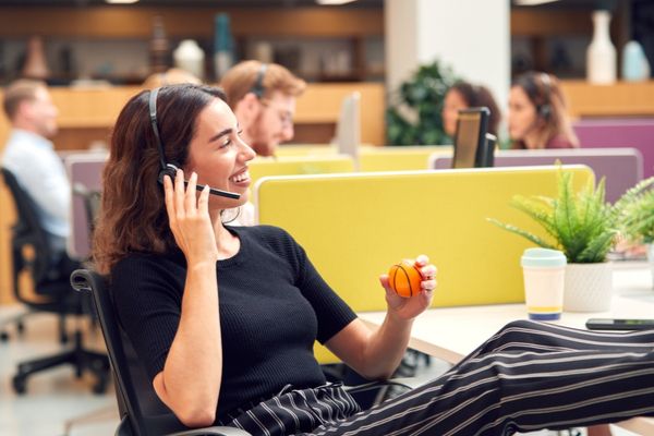 A woman playing with a stressball