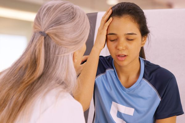 a young girl being seen for a concussion 