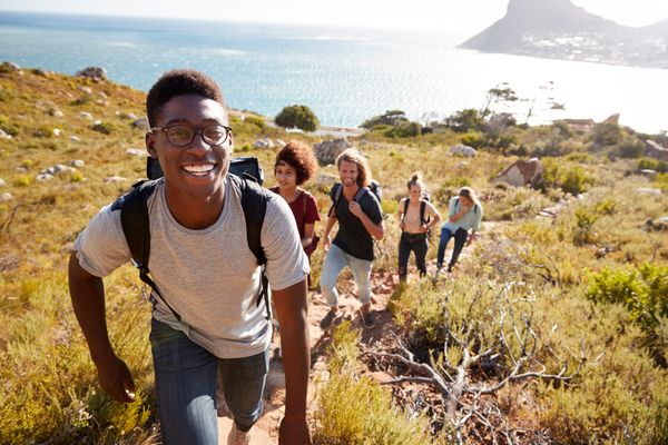friends hiking outside during the summer