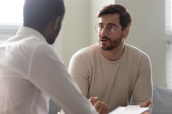 Man consulting with a mental health practitioner