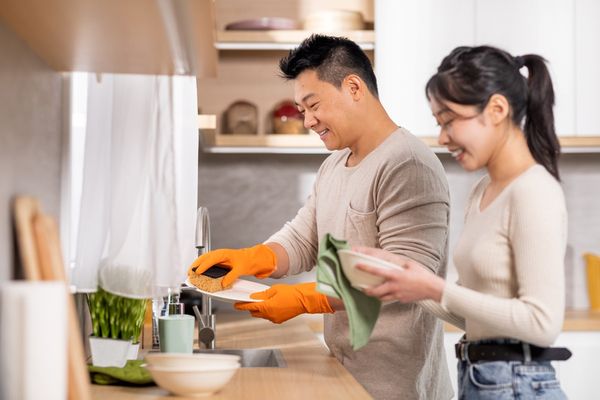 Friends doing dishes together 