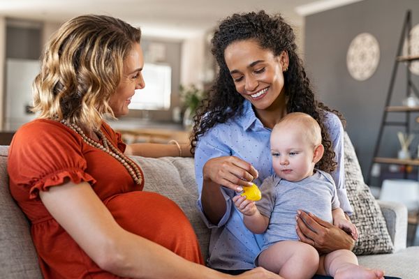 A woman and her friend with a baby 