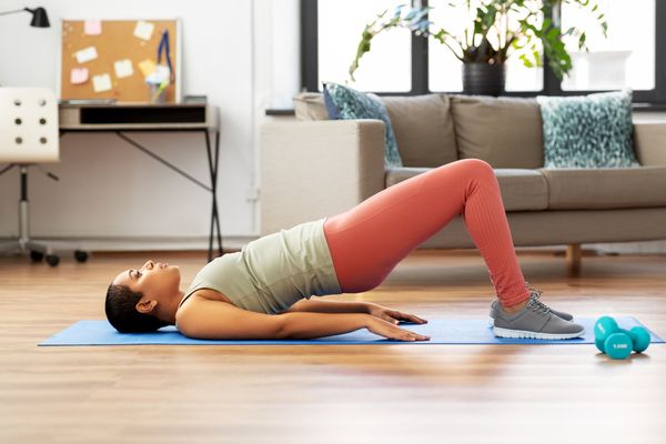 a woman doing pelvic floor exercises at home