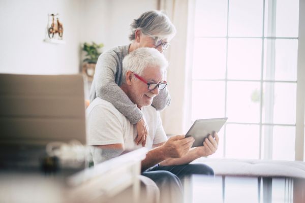 an elderly couple in their home