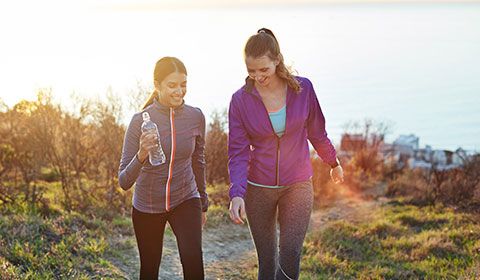 mother and daughter hiking together