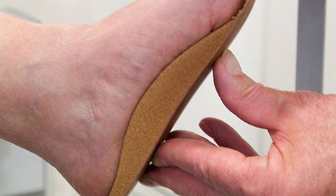 orthotic being fitted to patient