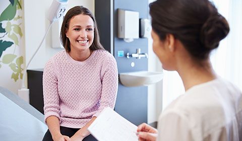 woman talking to female patient 