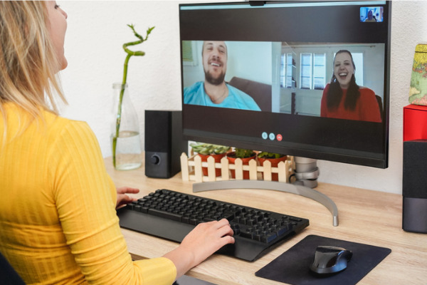 a woman talking with friends via video conference