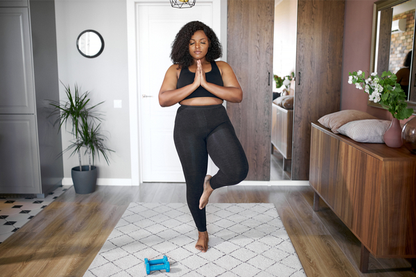 a woman doing yoga indoors 