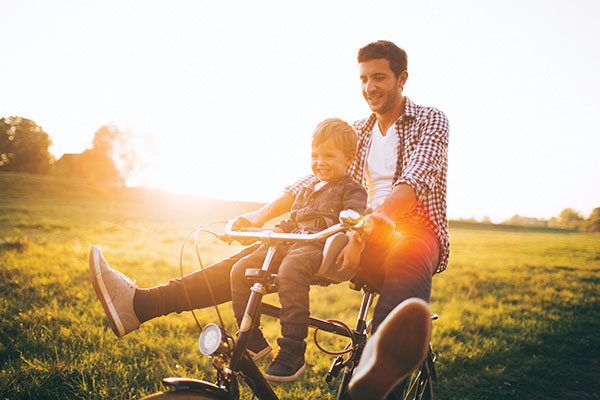 father and son on bike ride