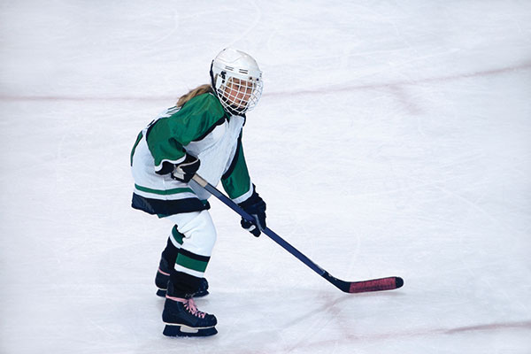 girl playing hockey