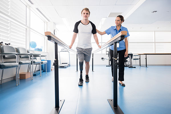 Man walking with occupational therapist