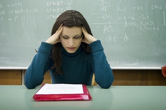 student with head on hands