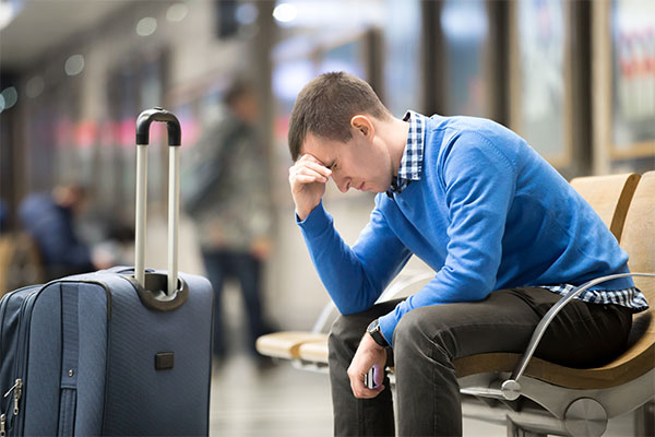 man struggling with travelling