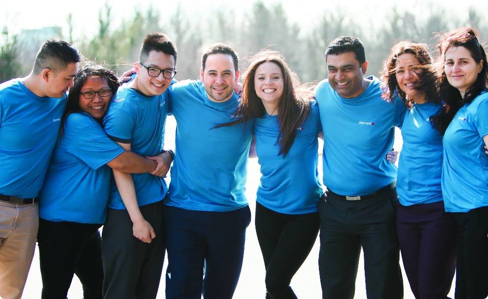 Lifemark employees huddling together