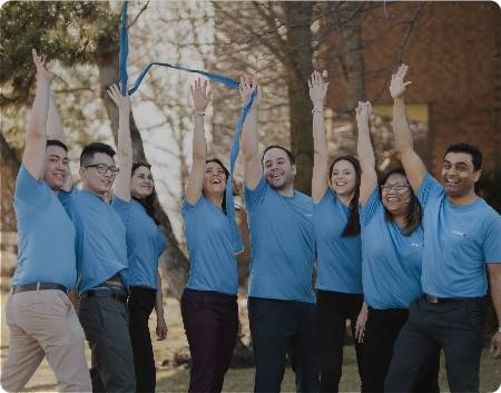 Student and graduates cheering outside