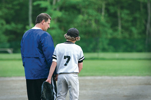 baseball coach with his player baseball coach with his player