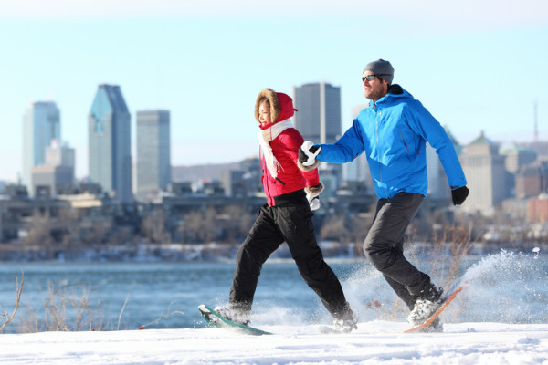 couple snowshoeing in the city