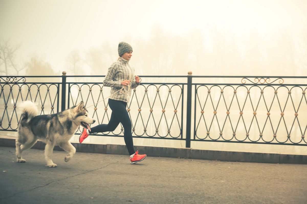 woman running with dog