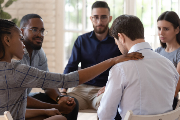 A group of people during a counselling session 