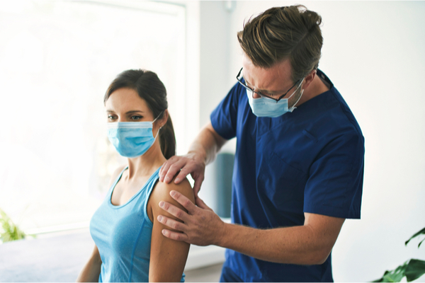 a physiotherapist treating a patient in a clinic