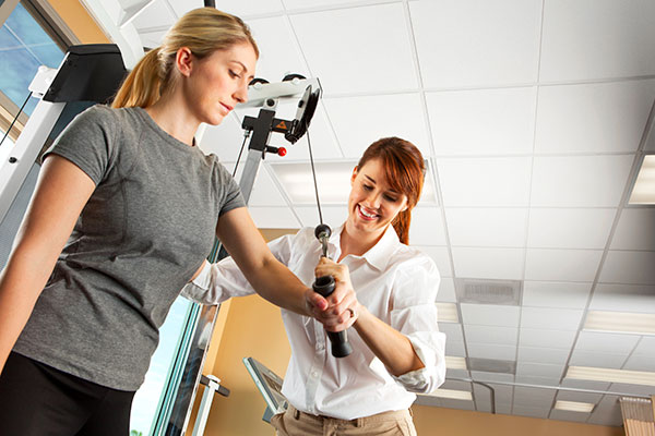 woman working with occupational therapist woman working with occupational therapist