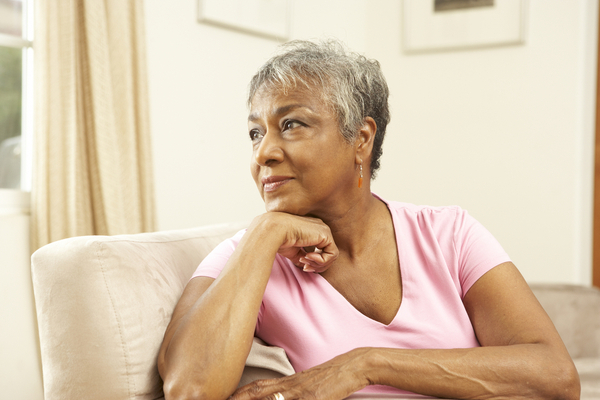 A woman looking thoughtful in the distance