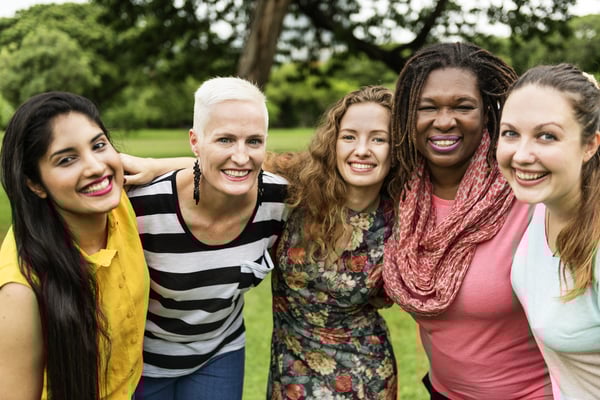 A group of women outside smiling
