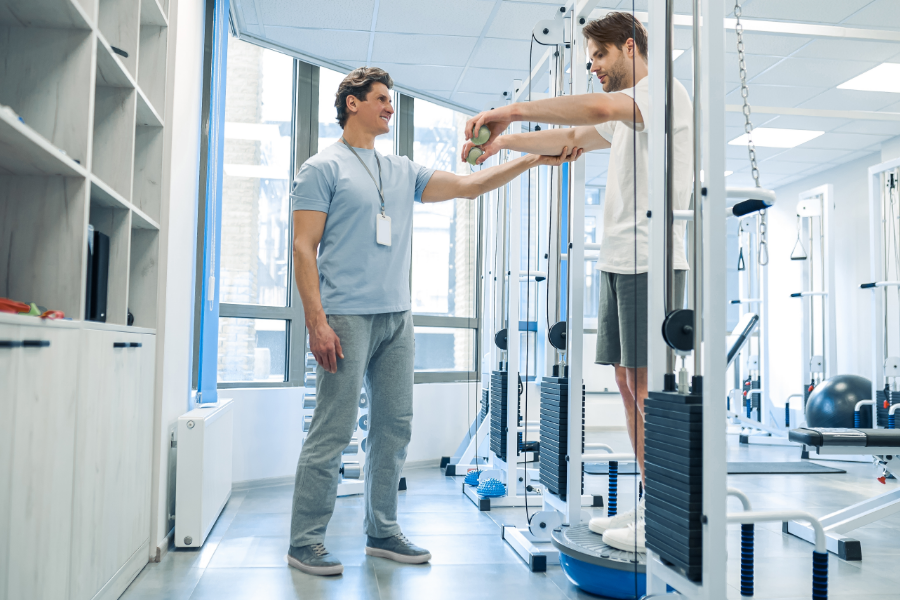 Physiotherapist guiding a patient through a balance exercise