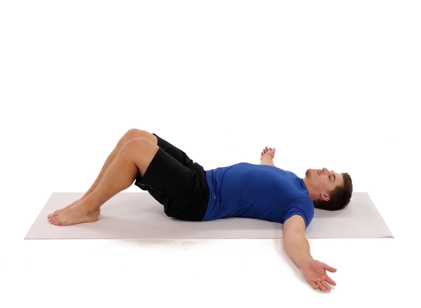 man relieving low back pain with low back rotation