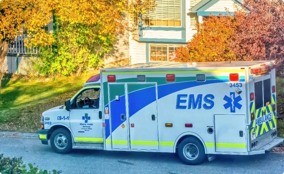 an ambulance parked in front of a house
