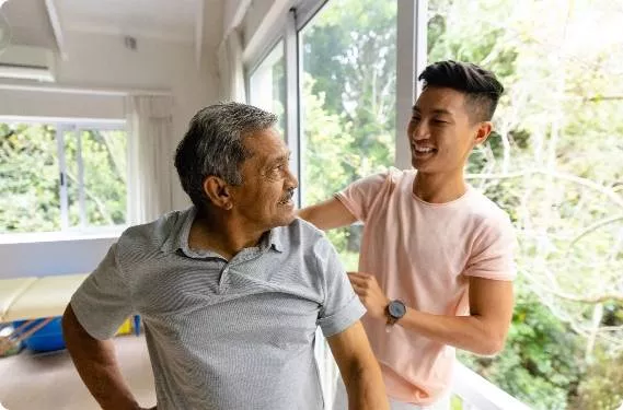 A student assisting a middle aged man