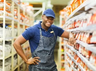 A black man standing in the aisle of a store